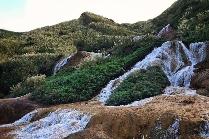 Taipei's Old Gold Rush Town: Jiufen Guided Night Tour - Golden Waterfall: a strong first photo stop